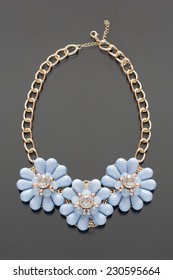 plastic necklace. three blue flower