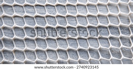 Plastic net structure on the table background.