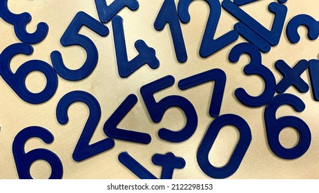 Plastic numbers and figures for the development of the child's intelligence, simple operations with numbers for education in childhood - Shutterstock ID 2122298153