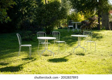 Plastic Outdoor Furniture With Chairs And Table In Outdoor.