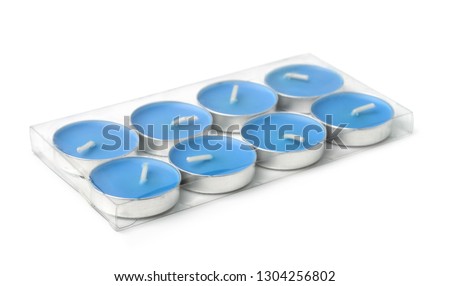 Plastic pack of tealight candles isolated on white