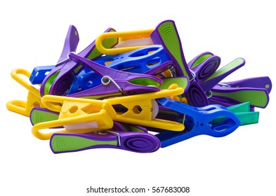 Plastic pegs of different shapes and colors isolated on a white background.  Background texture of various types of multicolored clothespins or clothes pegs close-up. Side view