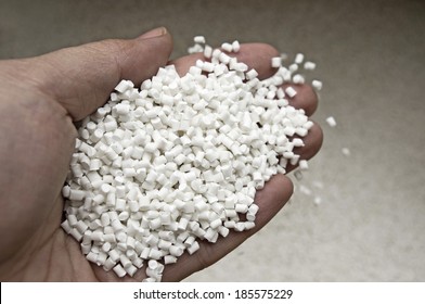 Plastic Pellets In Holding Hand, Raw Material Of Injection Molding.