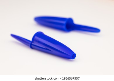 Plastic pen lids on white background