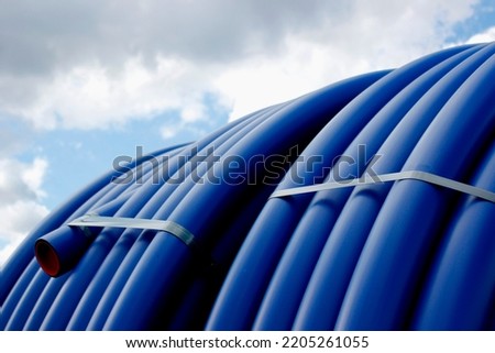 plastic pipe blue color with sky background industrial photo