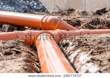 plastic pipe for sewage network in the base plate at the construction site