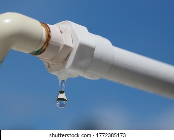 Plastic pipe with water`s leak. 