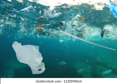 Plastic Pollution In Ocean. Plastic Bags, Straws And Bottles Pollute Sea. Underwater Trash Photo