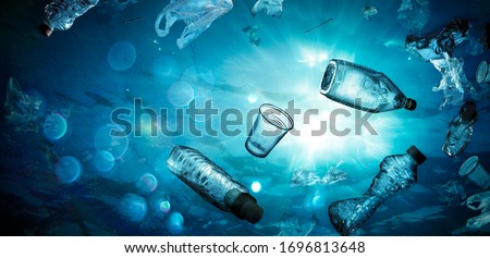 Plastic Pollution In Ocean - Underwater Shine With garbage Floating On Sea - Environmental Problem
