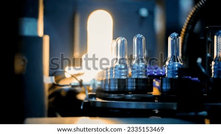 
Plastic preforms for making empty plastic bottles for container production plastic molding industry concept.