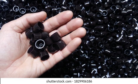 Plastic Products, Plastic Black Cosmetics And Gloves. Made From Injection Molding Machines In Factory Industry.