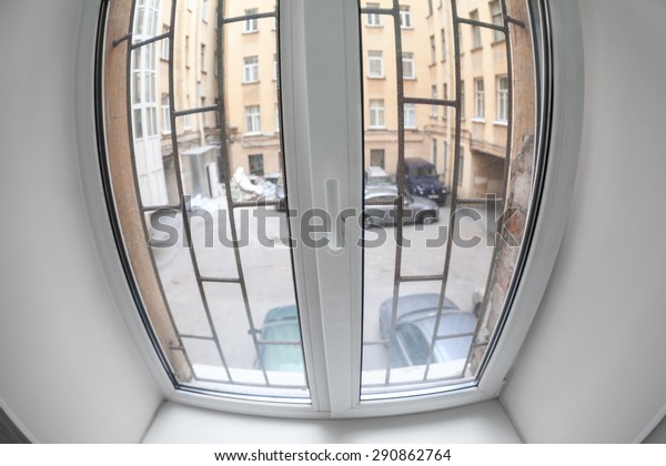 Plastic pvc\
window with bars screen to the\
courtyard