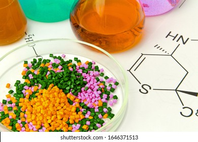 Plastic raw material in granules against the background of Chemical Laboratory and reagents. Polypropylene, Ethylene, Polypropylene research in laboratory conditions