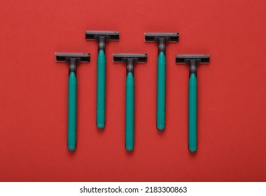 Plastic Razor On A Red Background