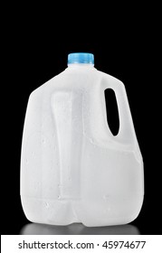 Plastic recyclable water, milk or juice  bottle of one gallon with water drops on the surface