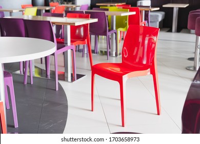 Plastic Red Chair At An Empty Fast Food Cafe. Concept Of Quarantine, Lockdown, Closed Business And Catering