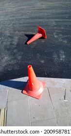 Plastic red traffic cones. Road traffic barrier. Pylons for traffic control. Construction site. Repair work. Channelizing devices. Restoration and reconstruction. Traffic barrier. Economic crisis.