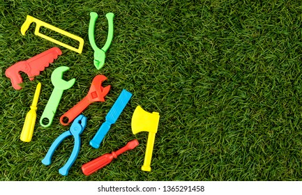 Plastic Repair Tool For Bright Colors On Green Artificial Grass, Text Entry Area