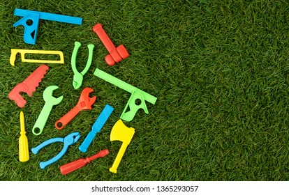 Plastic Repair Tool For Bright Colors On Green Artificial Grass, Text Entry Area