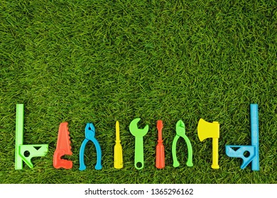 Plastic Repair Tool For Bright Colors On Green Artificial Grass, Text Entry Area