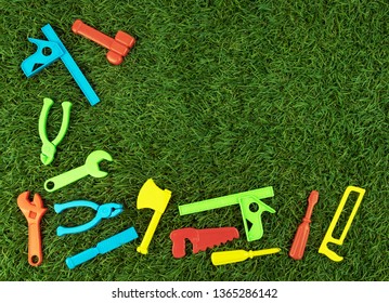 Plastic Repair Tools For Bright Colors On Green Artificial Grass Text Input Area