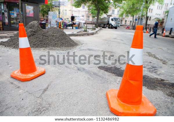 Plastic road cone. Road sign for\
temporary fencing while carrying out repairs on the\
road