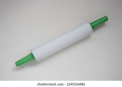 Plastic Rolling Pin On A White Background