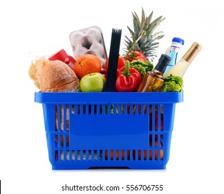 Plastic shopping basket with assorted grocery products isolated on white - Shutterstock ID 556706755