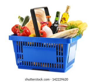 Plastic shopping basket with variety of grocery products isolated on white - Shutterstock ID 142229620