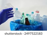 Plastic sorting for Recycling. Empty plastic bottles in trash bin sorting. Plastic bottles collection for Recycling. Empty Water Bottle for Recycling. Garbage Sorting  and waste. Plastics Reduce.  