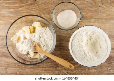 Plastic Spoon, Mix Of Margarine, Wheat Flour, Sugar In Transparent Bowl, Bowls With Sugar And Flour On Wooden Table. Top View