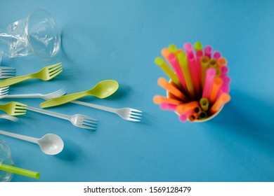 Plastic spoons, forks, straws and cup, Single use, Disposable tableware, Plastic pollution, waste, eco, ecology, recycle. Plastic processing problem
