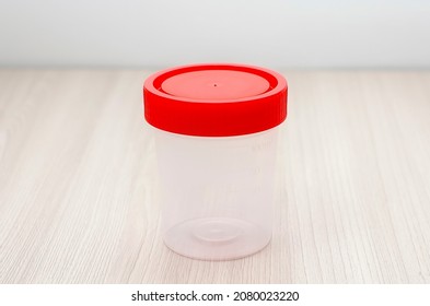 Plastic Sterile Container For Collecting Urine. Close-up, Soft Focus.