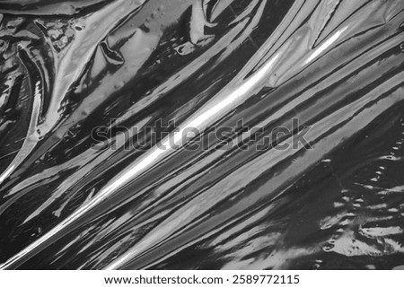 Plastic stretch wrap on black background