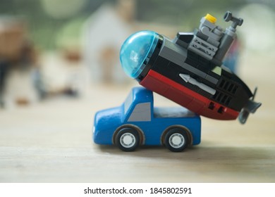 Plastic Submarine Toy Placed On Pickup Truck Blue. Concept Of Maintenance