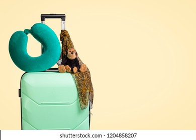 Plastic Suitcase With Wheels, Soft Toy, Travel Pillow, Neck Scar