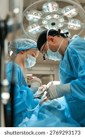 plastic surgeon performs surgery in the operating room