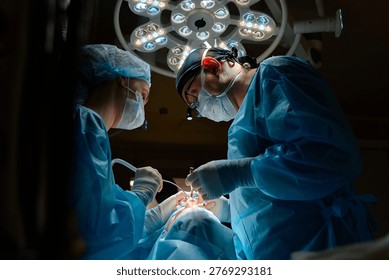 plastic surgeon performs surgery in the operating room