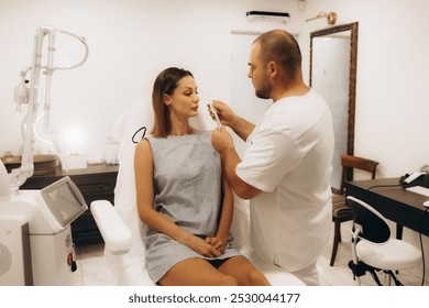 Plastic surgeon preparing for operation on woman face - Powered by Shutterstock