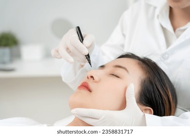 plastic surgery, beauty, Surgeon or beautician touching woman face, surgical procedure that involve altering shape of nose, doctor injection to prepare for rhinoplasty, medical assistance, health
 - Powered by Shutterstock