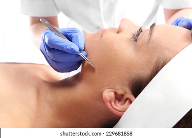 Plastic Surgery, Facial Skin Stretching.Caucasian Woman During Surgery Using A Scalpel