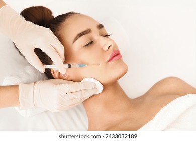 Plastic Surgery. Young Woman Receiving Botox Injection In Beauty Clinic - Powered by Shutterstock