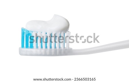 Plastic toothbrush with paste on white background, closeup