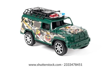 Plastic toy army car isolated on white background. High quality photo