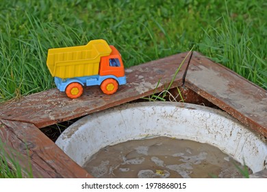 Plastic Toy Dump Truck Near The Composting Facility