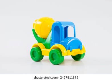 Plastic toy multi-colored truck on a white background. - Powered by Shutterstock