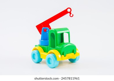 Plastic toy multi-colored truck on a white background. - Powered by Shutterstock