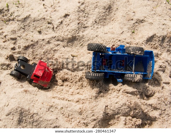 Plastic toy truck on the sands, accident in the\
salt sand of the coast