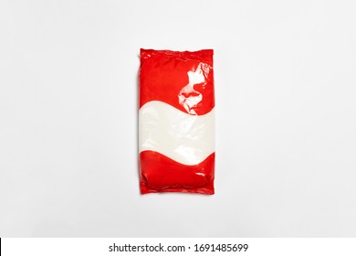 Plastic transparent Bag(package) with full Granulated Sugar isolated on white, Vacuum package Mock-up.High resolution photo.