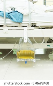 plastic urine collection bag hang under patient bed in hospital